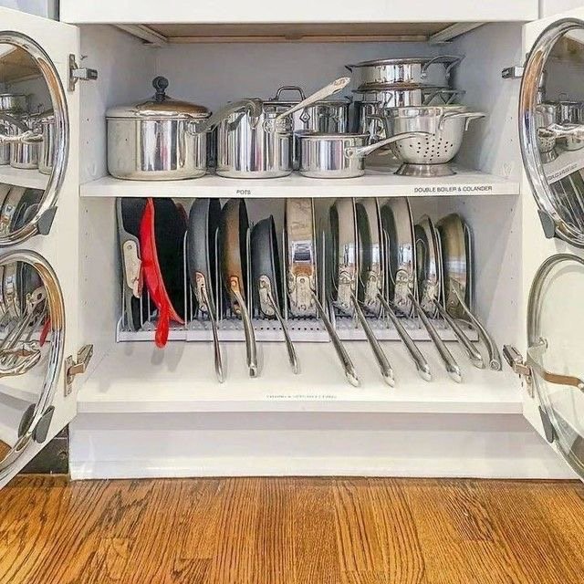Organised cabinet with pots and pans