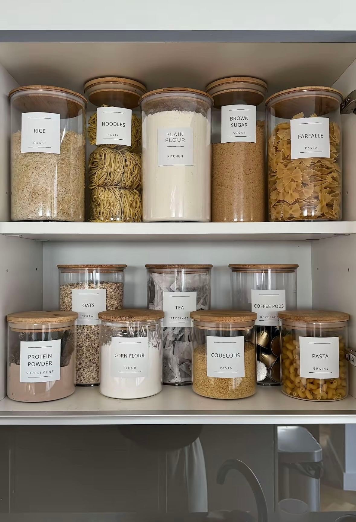 Organised pantry shelf with glass jars