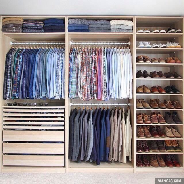 Organised walk-in closet with clothing and shoes